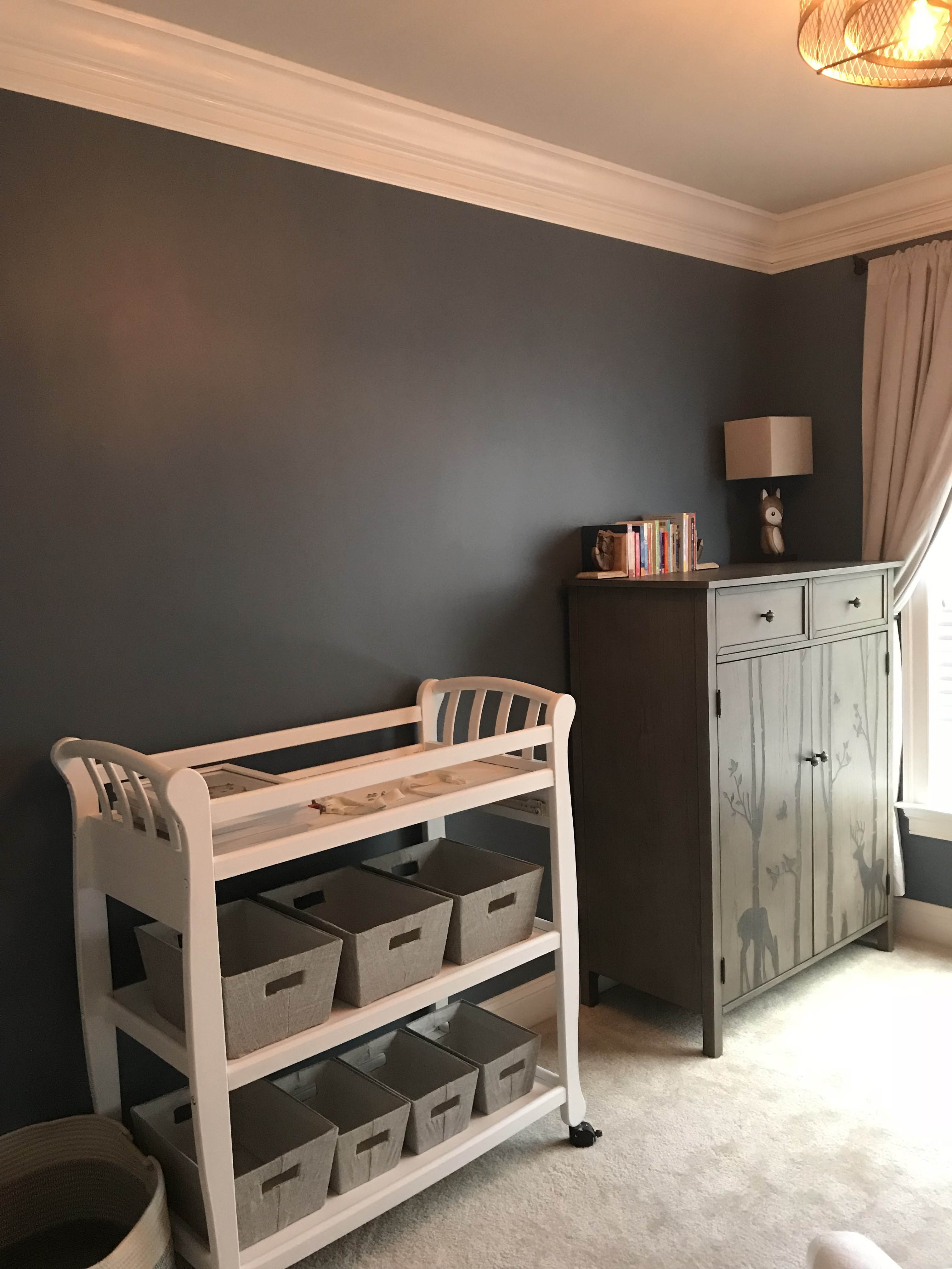dresser and changing table in nursery